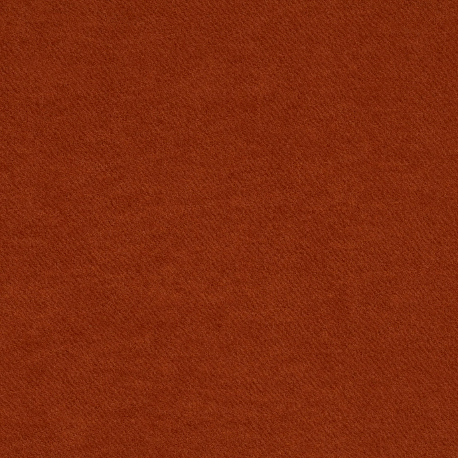 Close-up of dark tangerine orange fabric with a soft brushed, subtly mottled surface