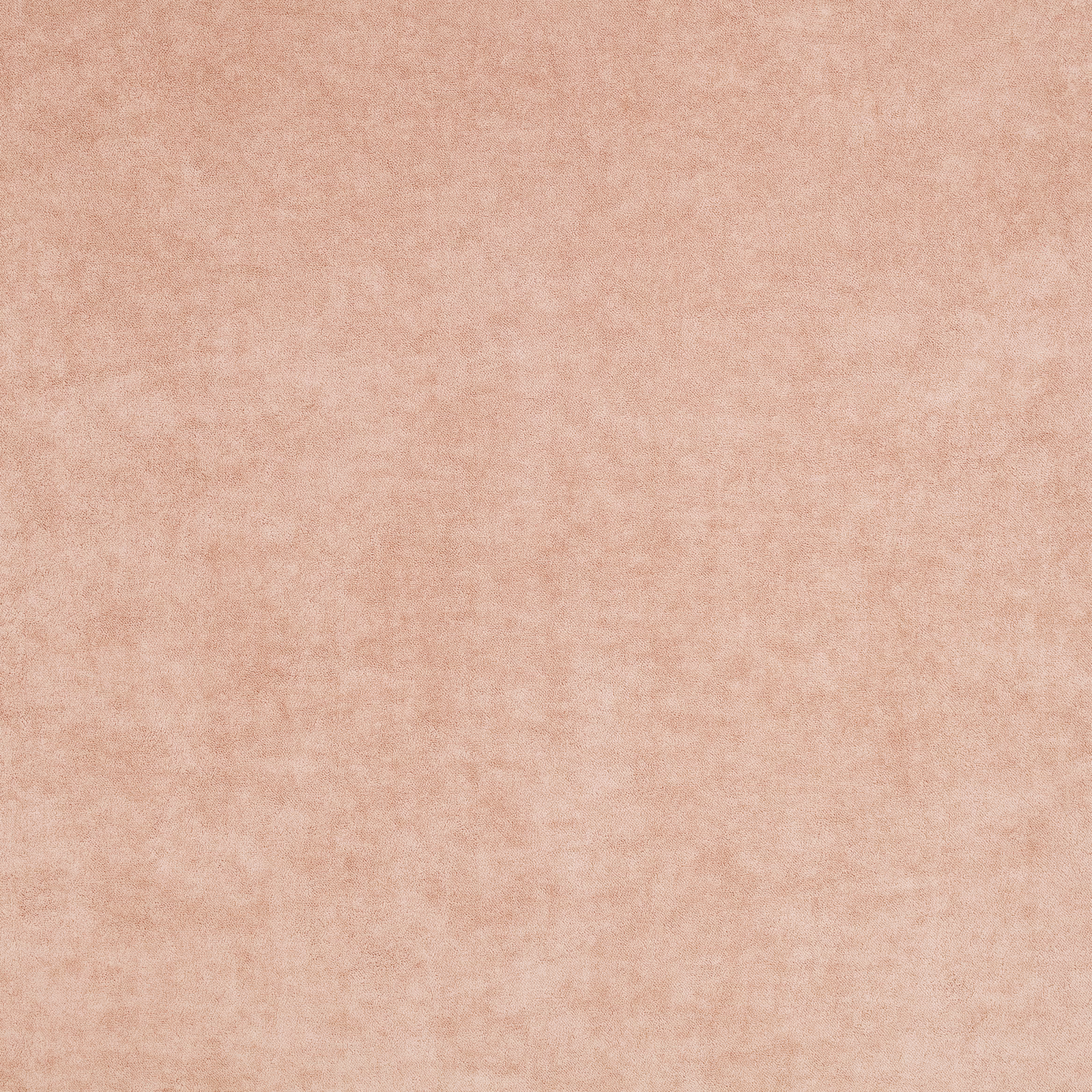Close-up of warm dusty pink fabric with soft mottled, plush texture