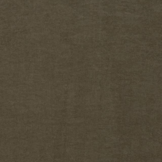 Close-up of muted lichen olive fabric with a softly mottled, shadowed surface