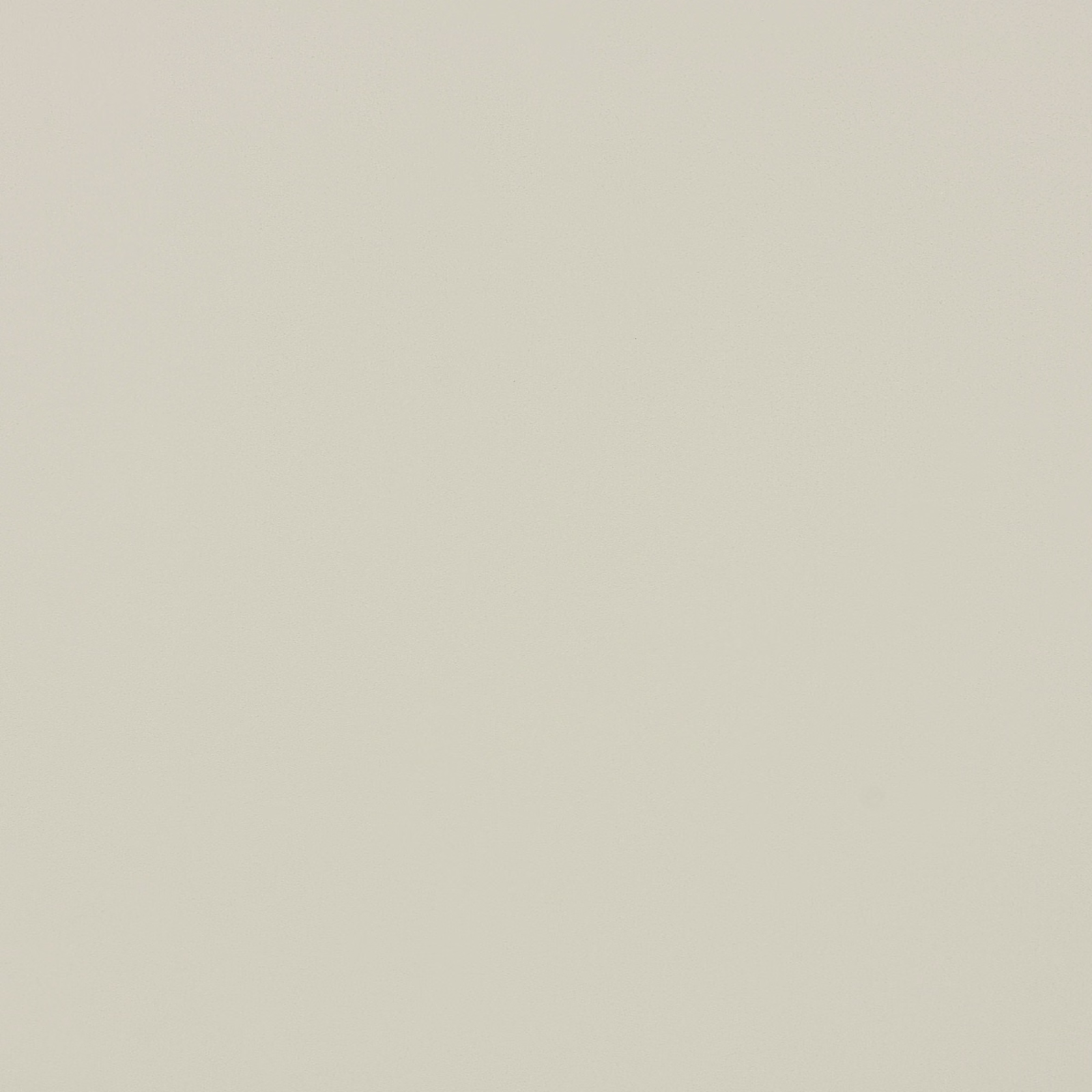 Close-up of softly textured ivory-white suede-look fabric with a matte finish