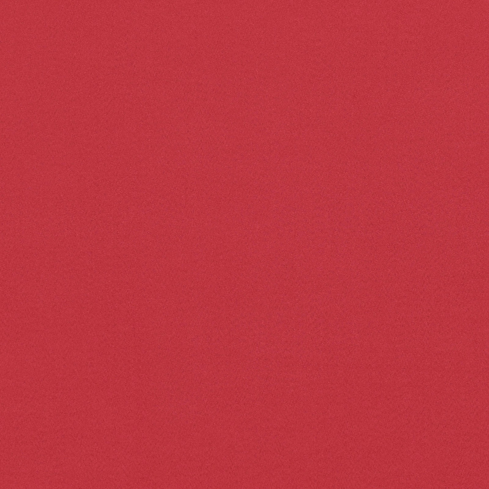 Close-up of chilli-red suede with a soft, finely grained matte surface