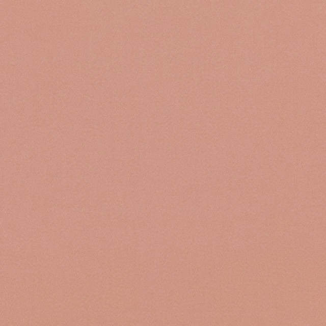 Close-up of plain muted clay terracotta fabric with a soft suede-like surface