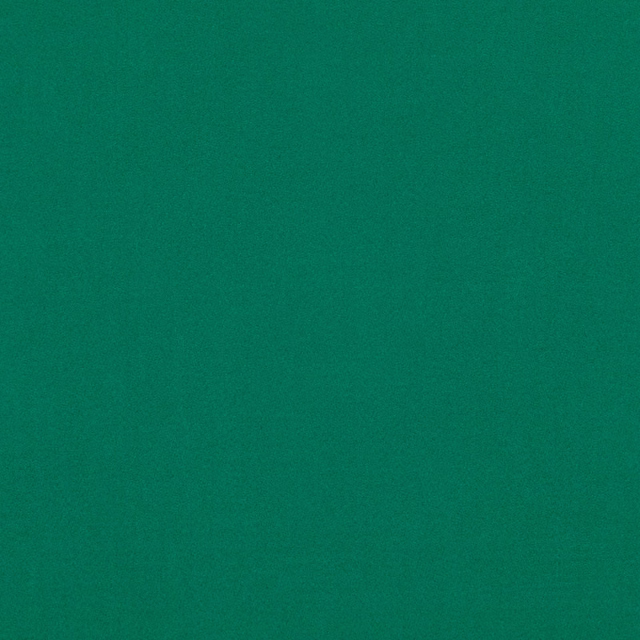 Deep forest-green teal upholstery fabric with a softly mottled suede-like surface