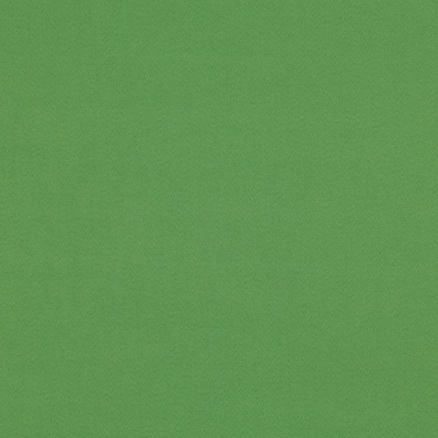 Close-up of plain grass-green suede-look fabric with a fine, softly mottled surface