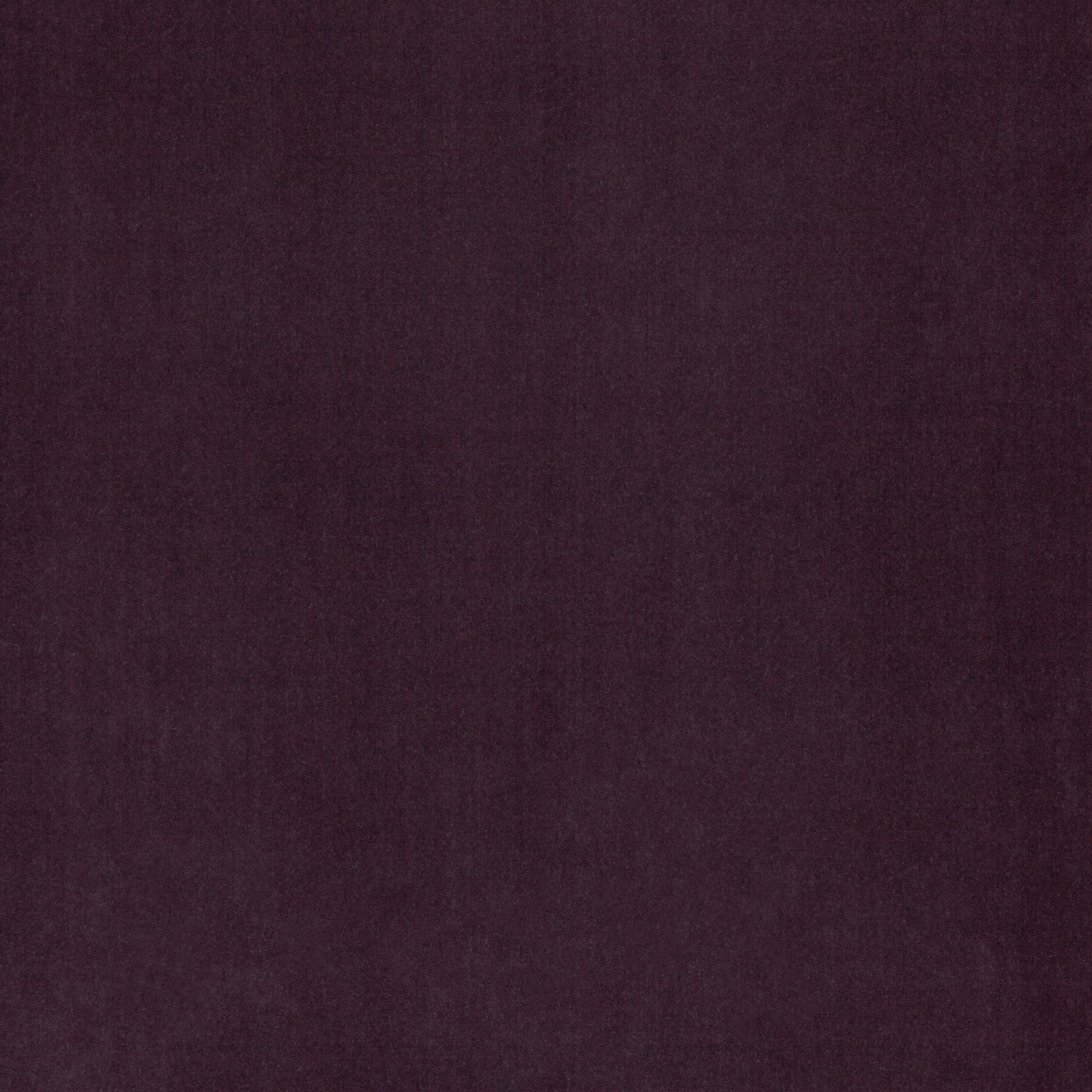Deep plum upholstery fabric with a softly mottled, subtly textured surface