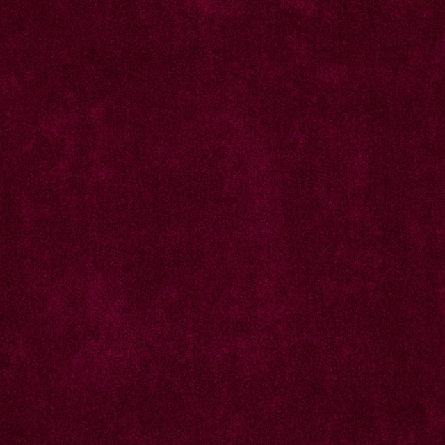 Deep ruby-red fabric with softly mottled, velvety surface texture
