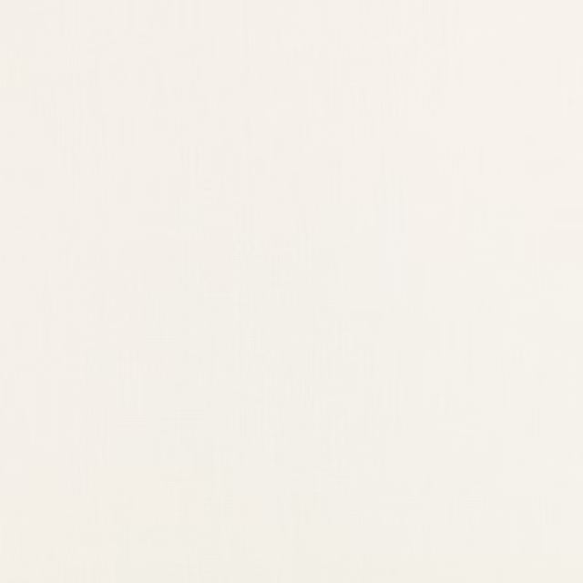 Close-up of soft porcelain-white fabric with a barely visible fine woven texture