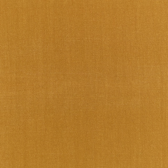 Warm tobacco-ochre plain weave with subtle crosshatched texture in close-up