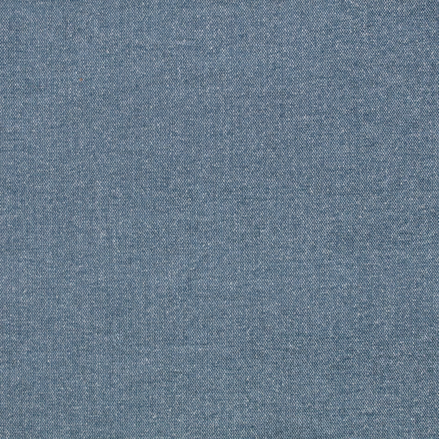 Close-up of muted denim-blue fabric with fine flecked woven texture