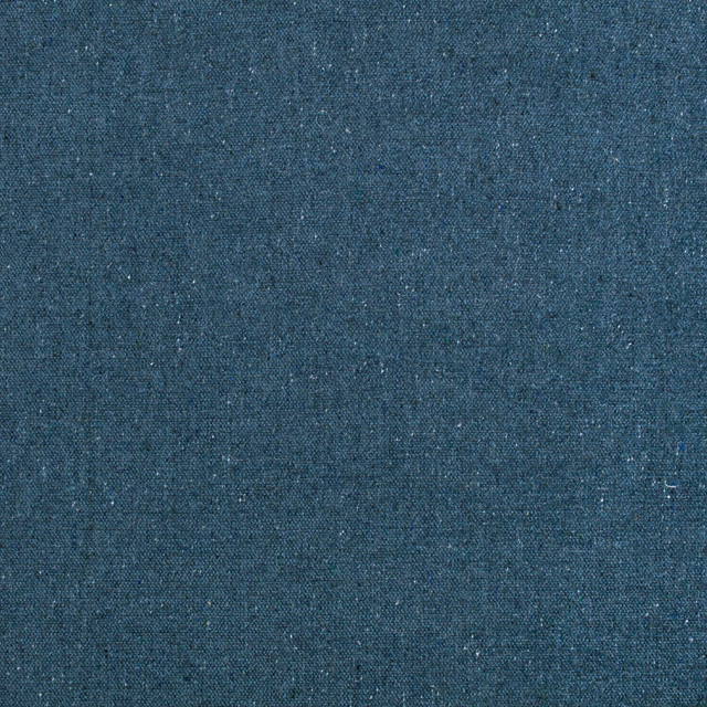 Close-up of deep petrol blue woven fabric with subtle flecked texture