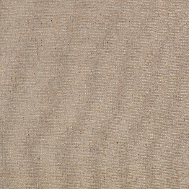 Warm putty beige upholstery fabric with fine charcoal and rust flecks in a tight weave