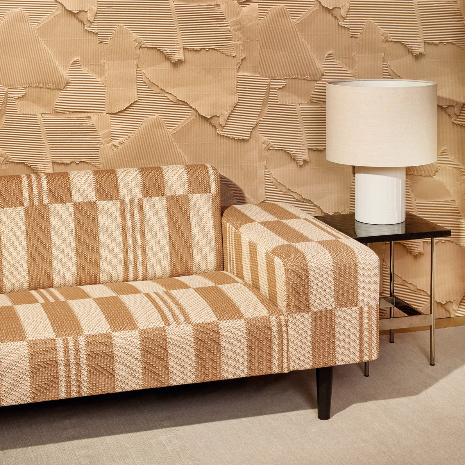 Warm cappuccino and ivory checkerboard knit with raised ribbed texture on a sofa and armchair