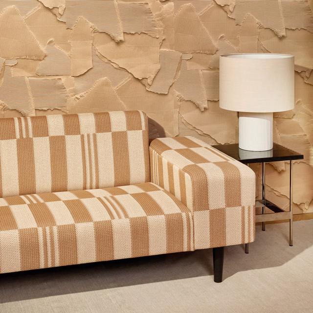 Warm cappuccino and ivory checkerboard knit with raised ribbed texture on a sofa and armchair
