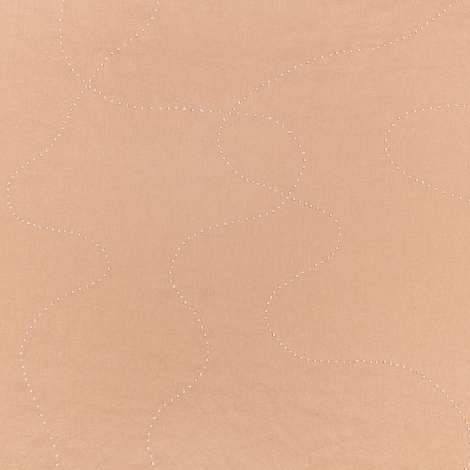 Warm clay fabric with pale dotted, looping lines and a softly matte surface