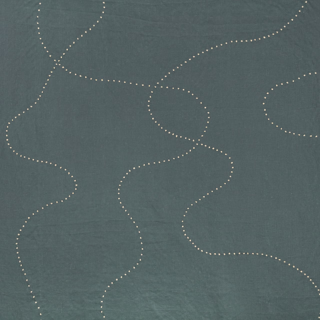 Cool blue-grey swatch with pale dotted meandering lines and fine woven texture