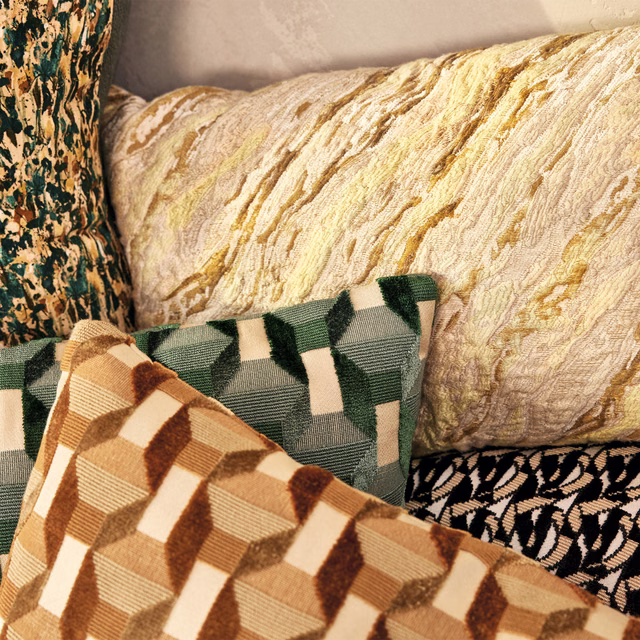 Warm ivory textile with ochre-gold painterly striations and tactile rippled texture