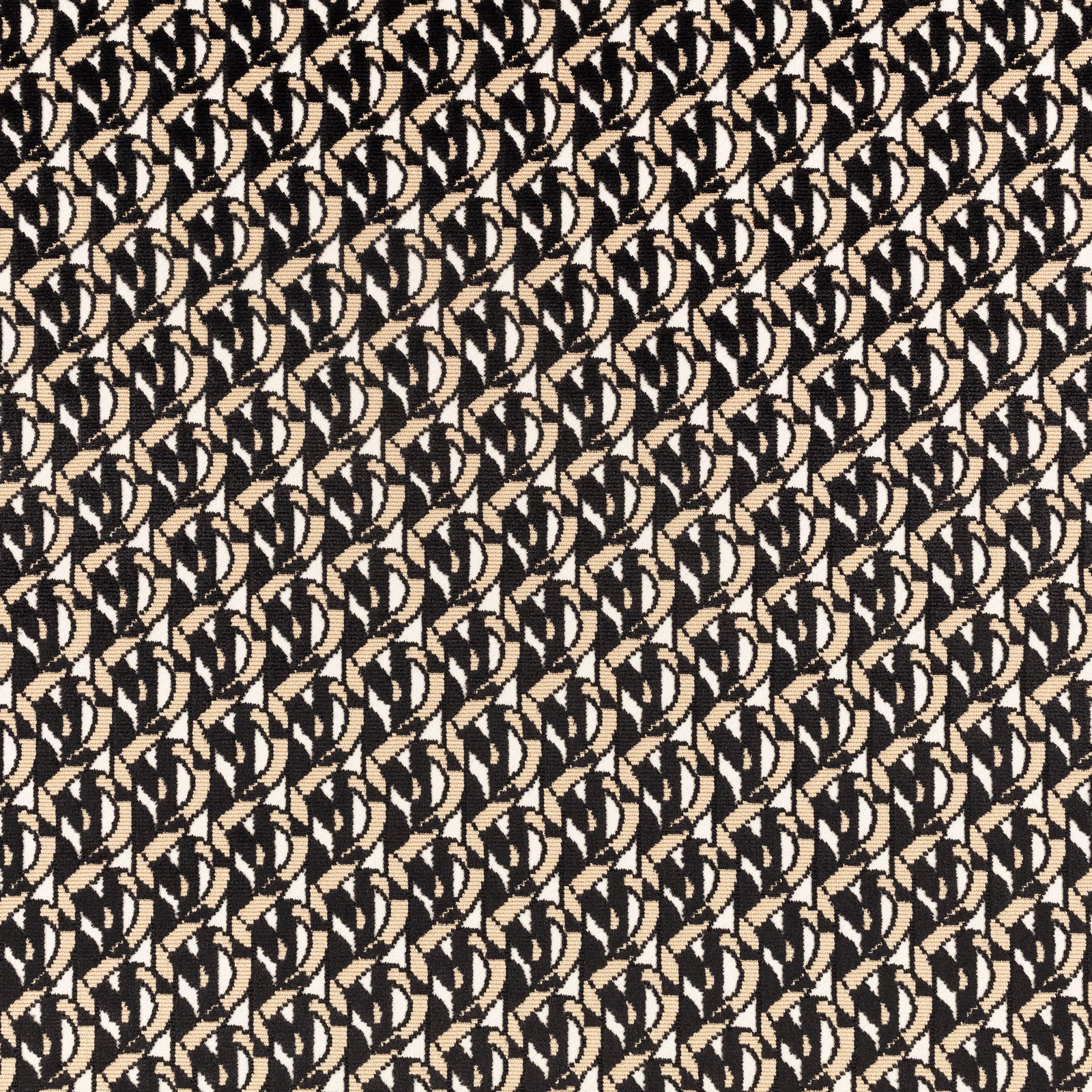 Close-up of black, cream and tan woven interlocking leaf-like motifs
