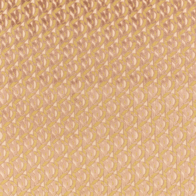 Blush pink woven fabric with small ochre and cream curved monogram motifs