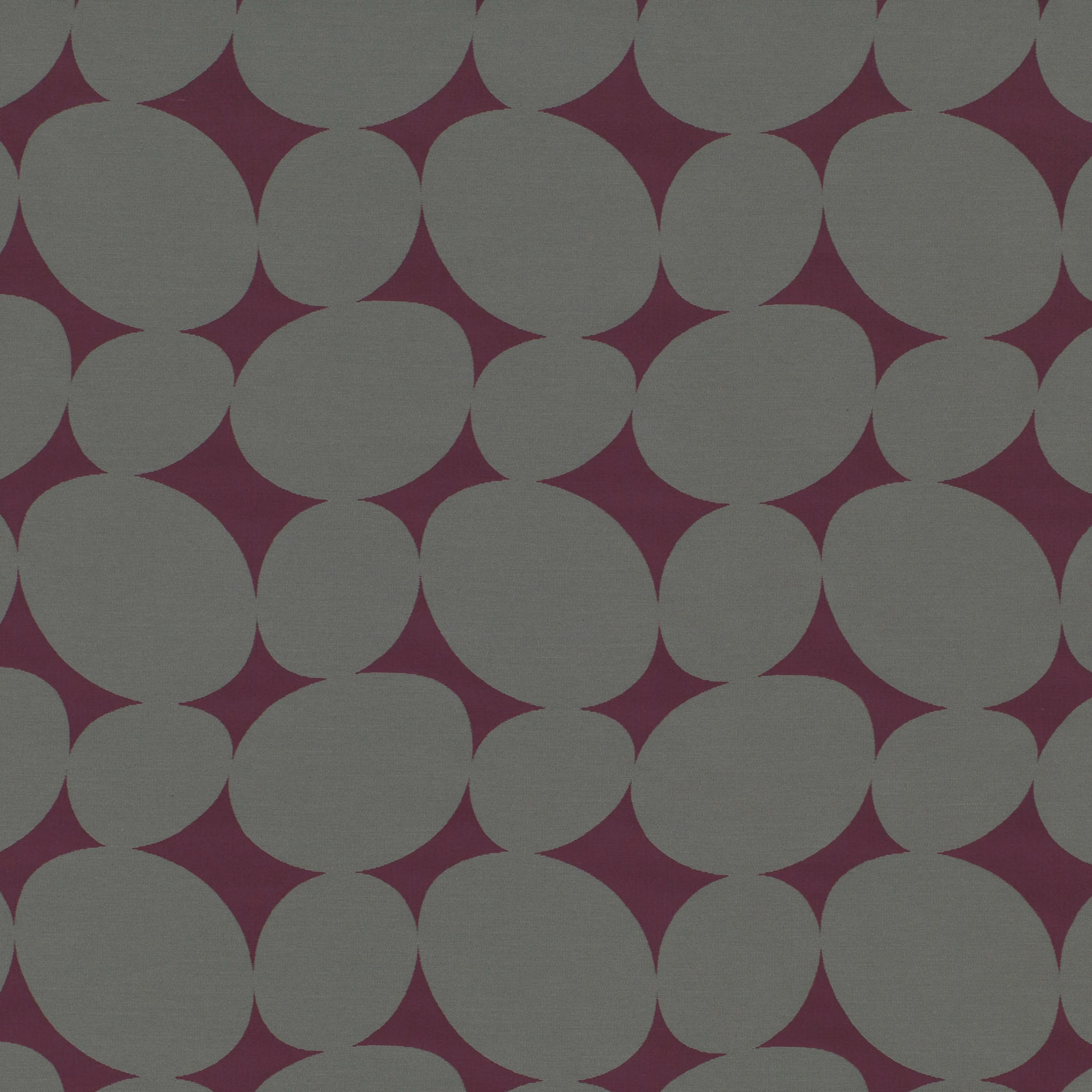 Deep berry textile with large muted grey circles and a fine woven texture