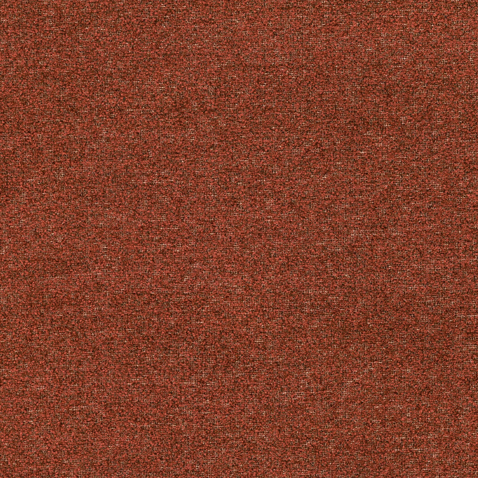 Close view of rust-orange woven textile with fine dark flecks and tonal texture