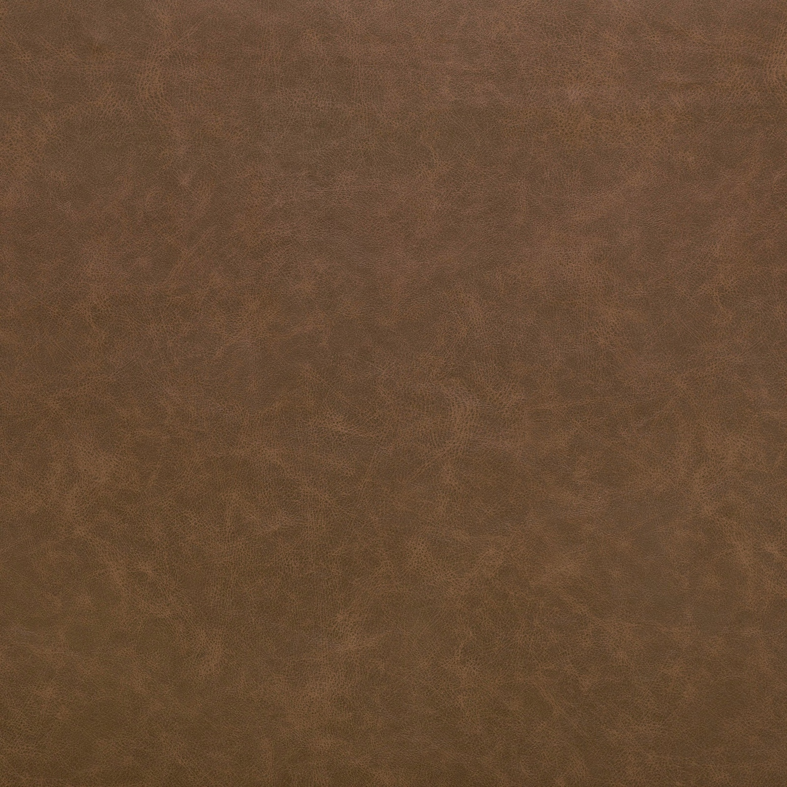 Close-up of warm hazelnut brown fabric with cloudy mottled grain texture