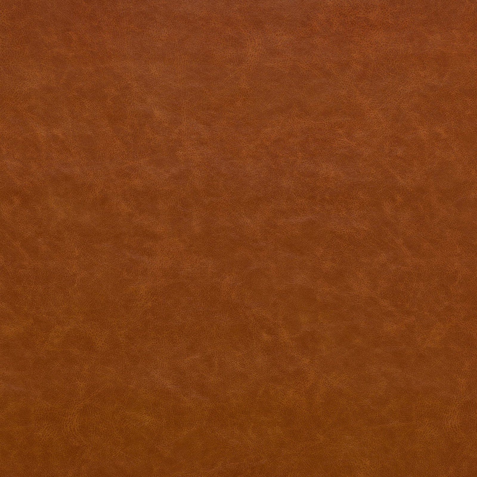 Warm caramel-tan fabric with cloudy mottling and a softly brushed-looking surface