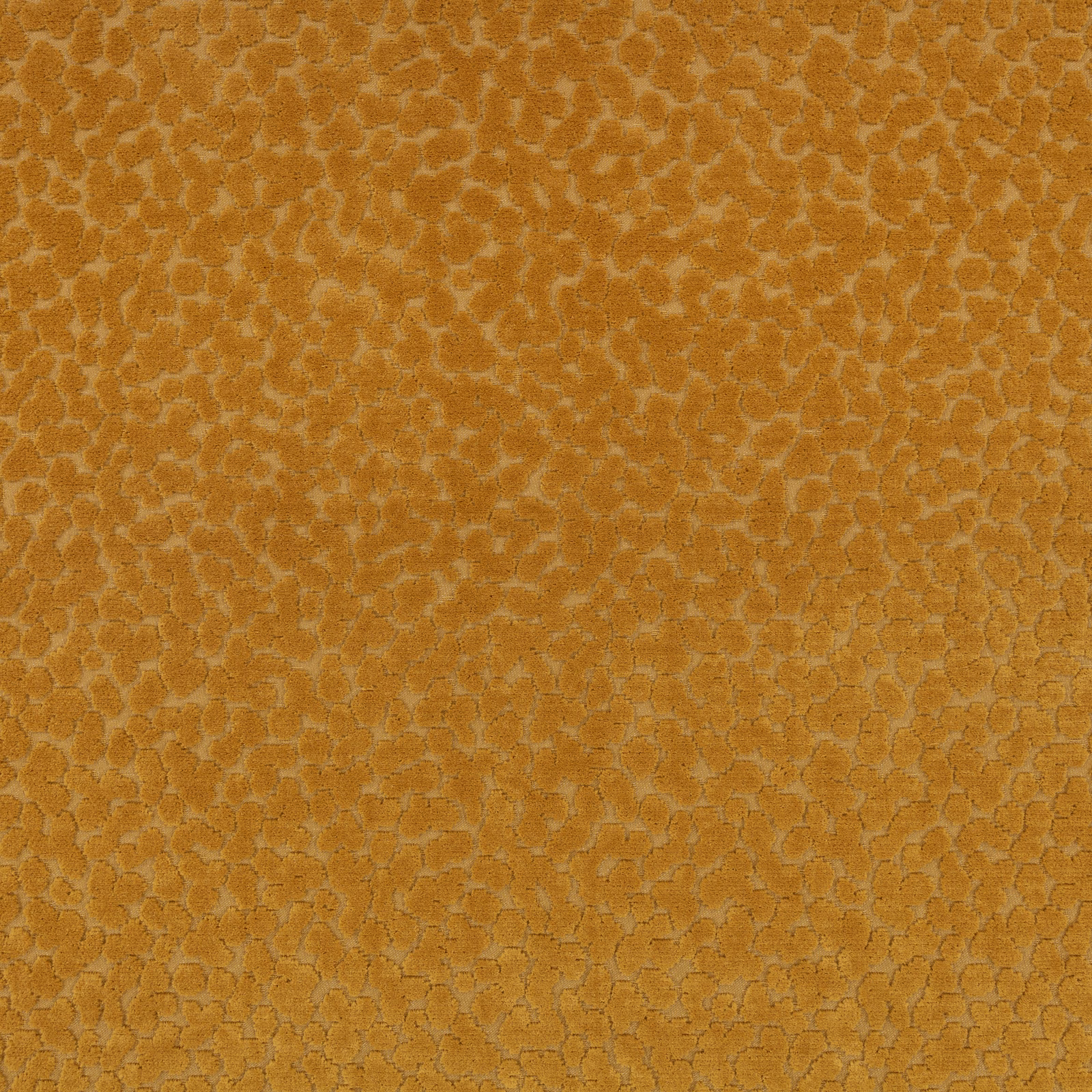 Close-up of warm tobacco fabric with a small irregular honeycomb-like textured motif