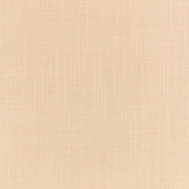 Close-up of warm oat-beige canvas with a fine, subtly crosshatched weave