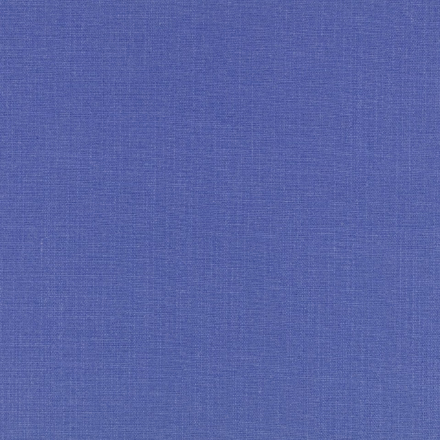 Close-up of saturated cobalt-blue woven fabric with subtle crosshatched texture