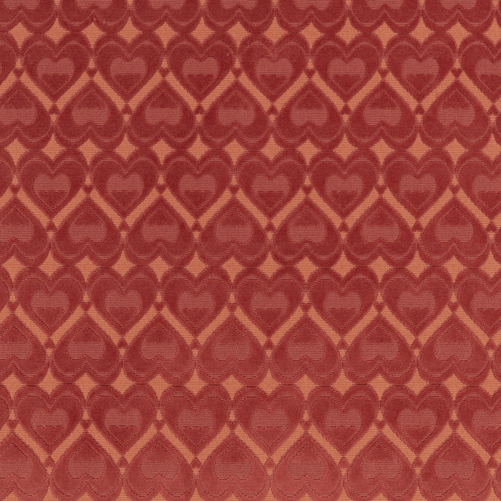 Ruby-red woven fabric with rows of tonal hearts and warm terracotta outlines