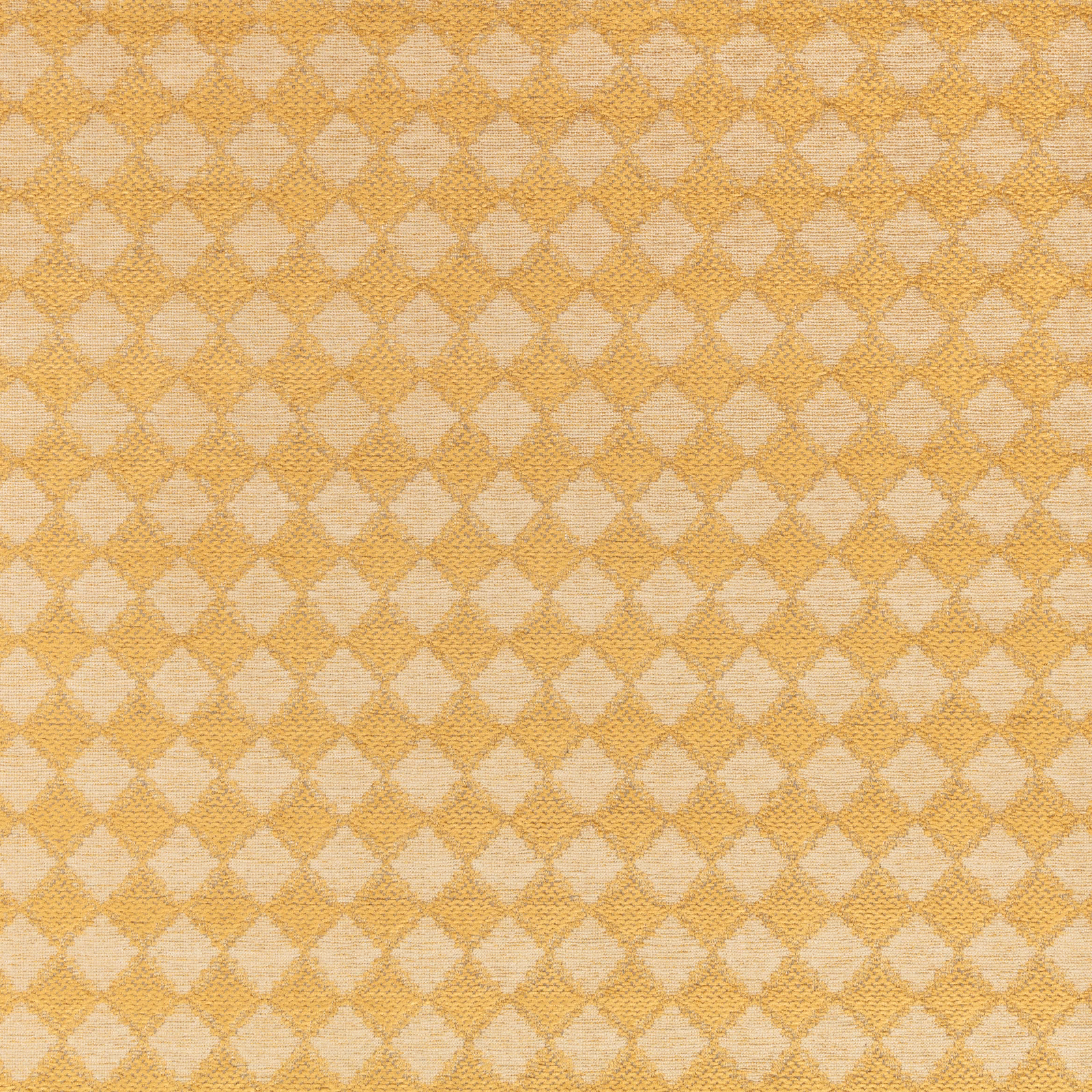 Warm ochre and cream woven textile with a small repeating diamond lattice motif