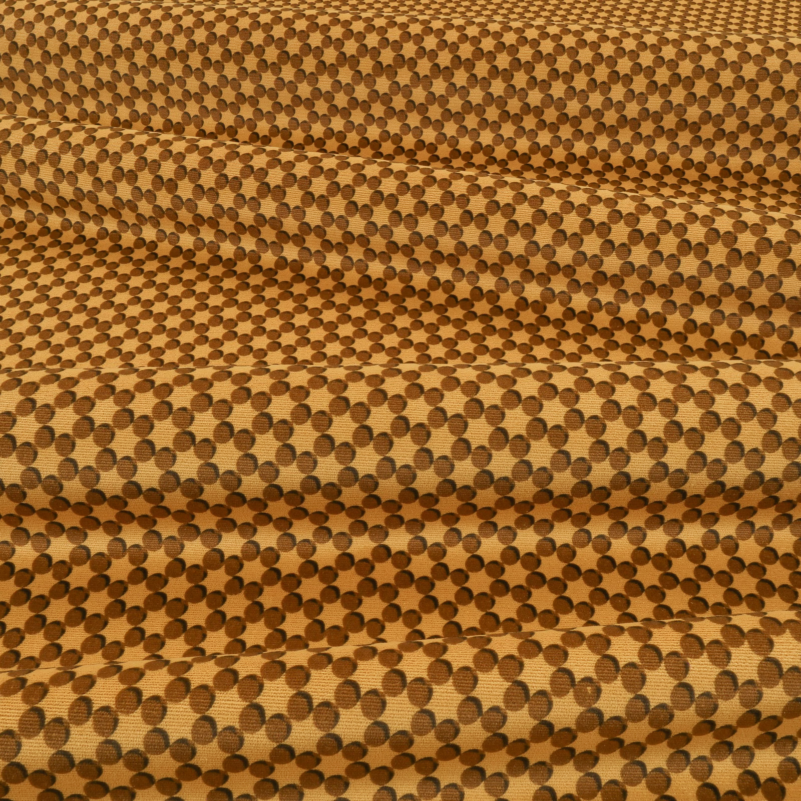 Warm tobacco woven fabric with dense dark brown circular dot pattern and tactile surface