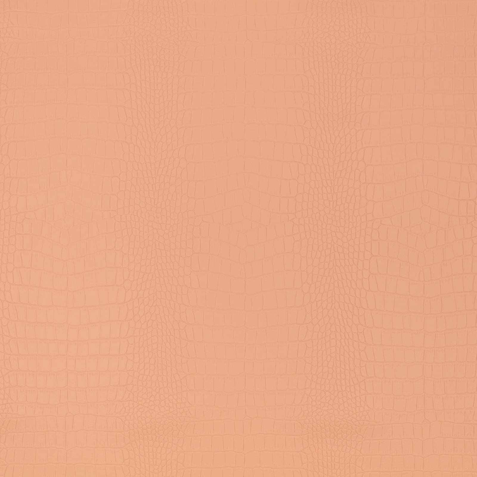 Warm peach-clay textile with tonal embossed crocodile pattern and softly varied reptile-scale texture