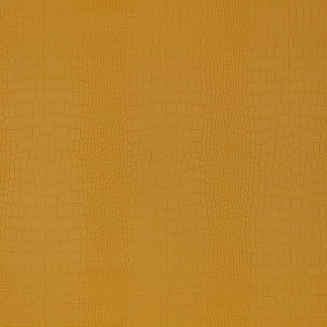 Warm golden ochre crocodile-effect fabric with tonal scales and tactile raised texture