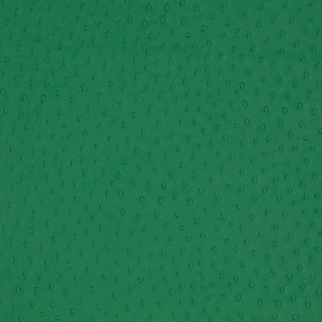 Emerald green fabric with tiny darker oval marks and softly textured surface