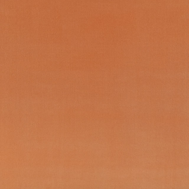 Warm terracotta-orange plain weave with subtle tonal texture and a softly brushed surface