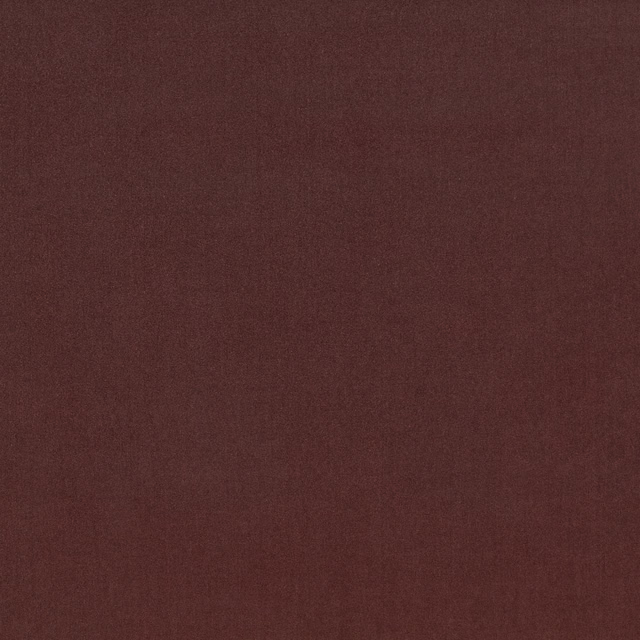 Dark fig-burgundy textile swatch with a subtle, finely woven plain texture