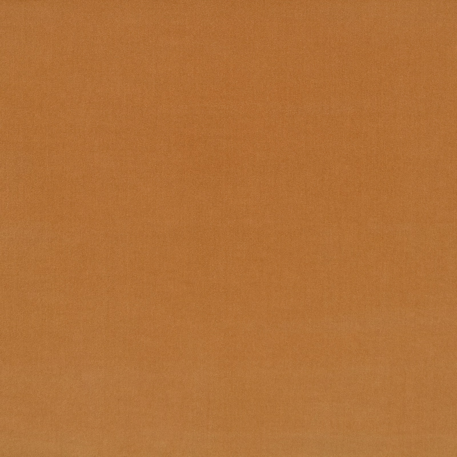 Close-up of plain warm Havana orange textile with subtle tonal surface texture