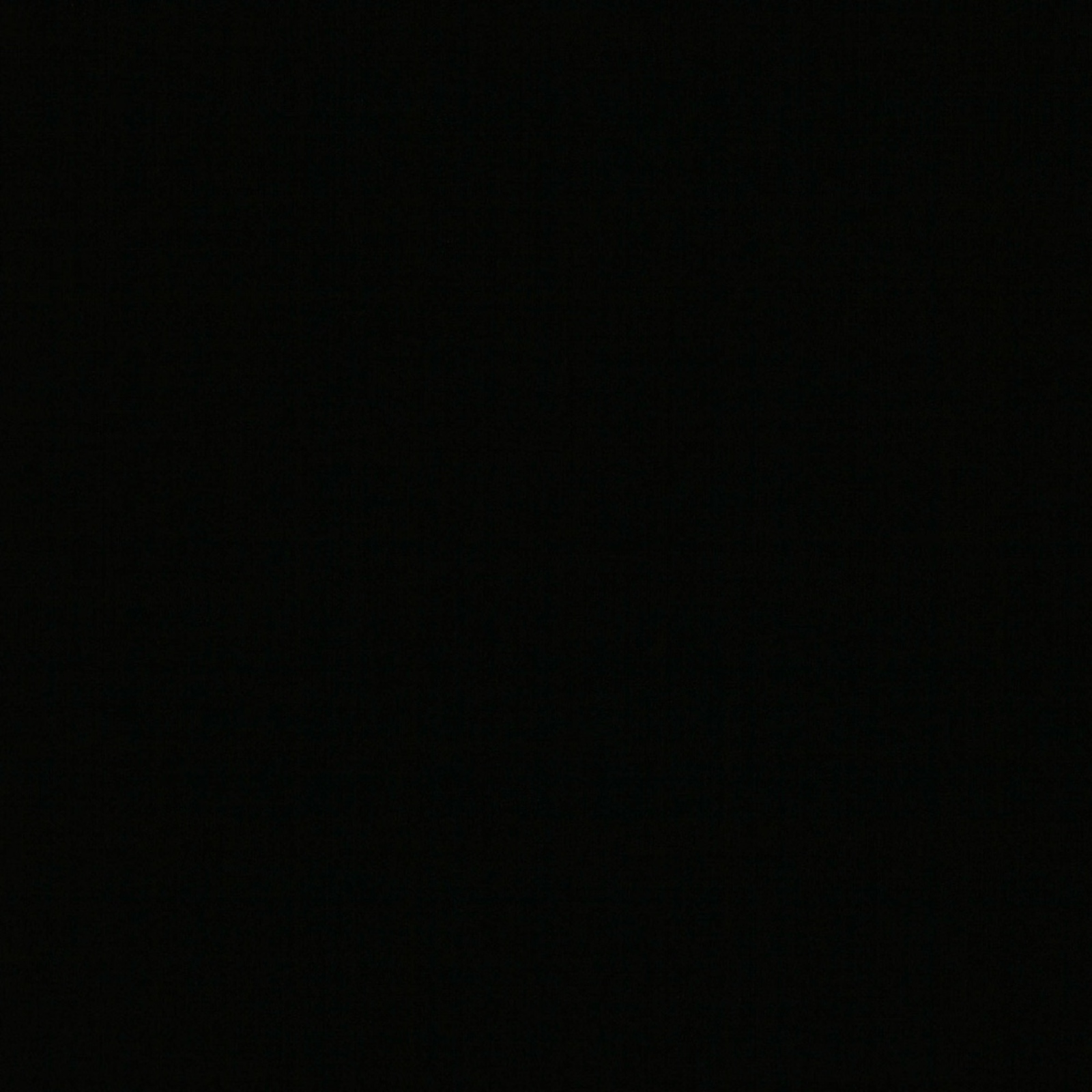 Near-black Ice Jet Black fabric swatch with a faint, low-sheen woven texture
