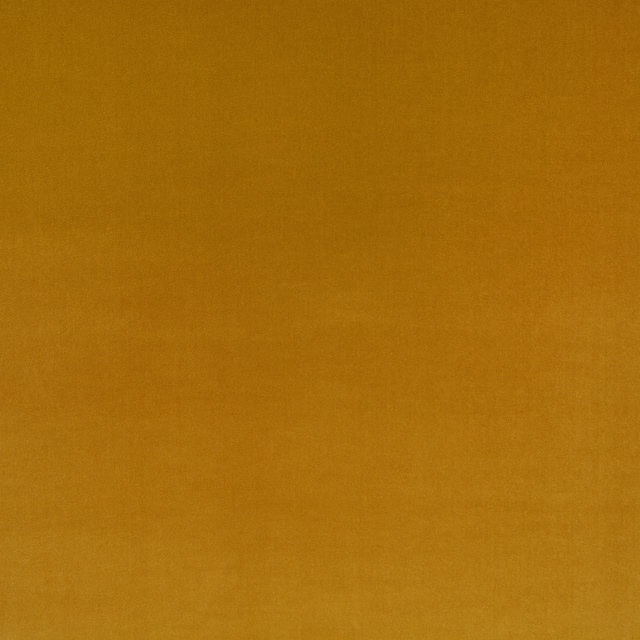 Close-up of warm golden ochre fabric with a subtle plain woven texture