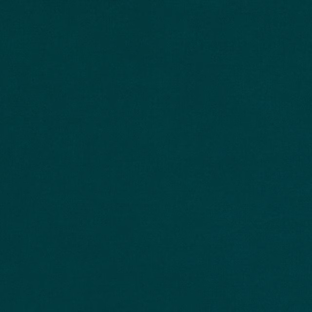 Deep blue-teal plain fabric with a subtly grainy, softly mottled surface