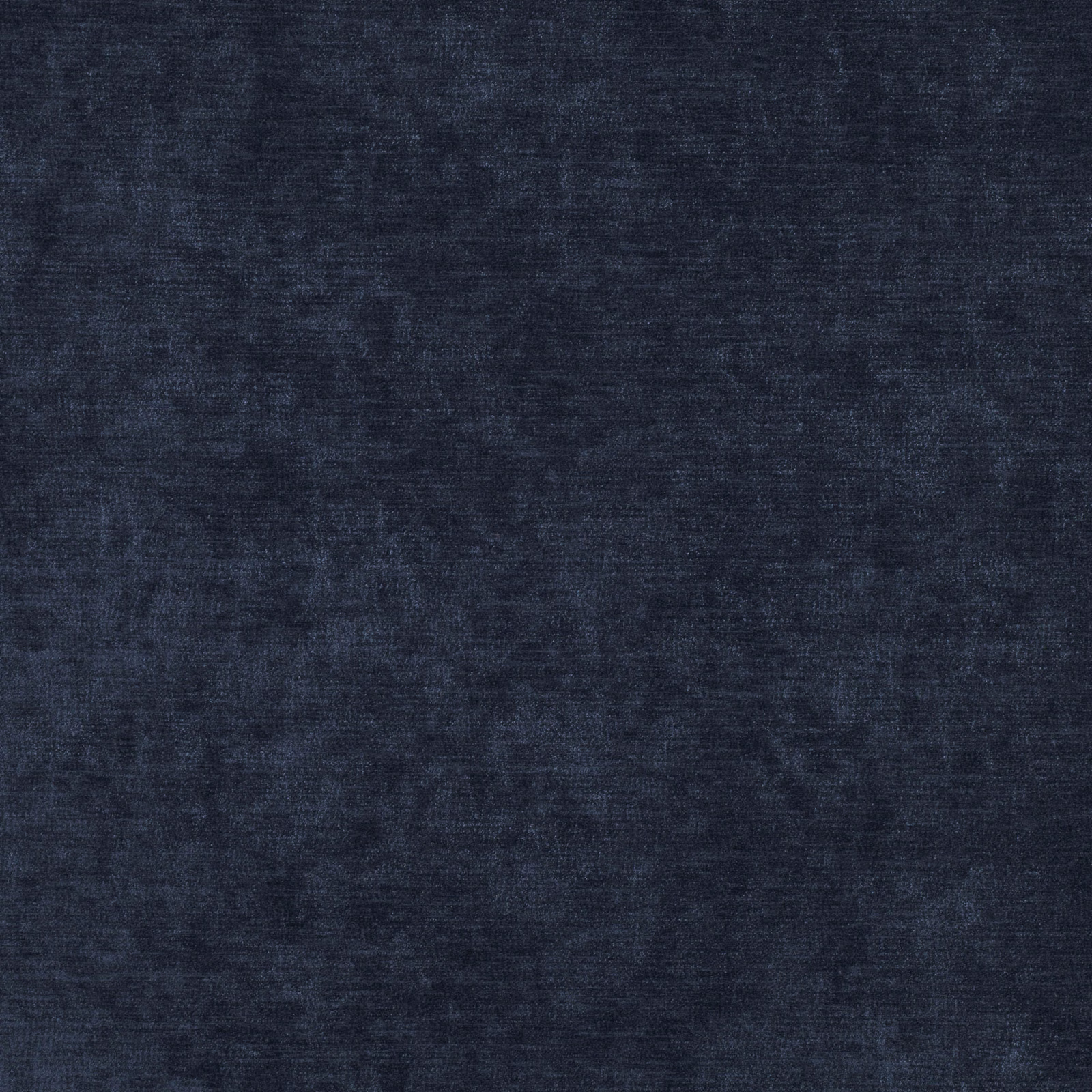 Close-up of dark navy Ion fabric with softly mottled, shadowed woven texture