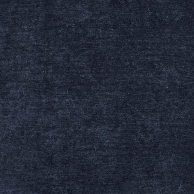 Close-up of dark navy Ion fabric with softly mottled, shadowed woven texture