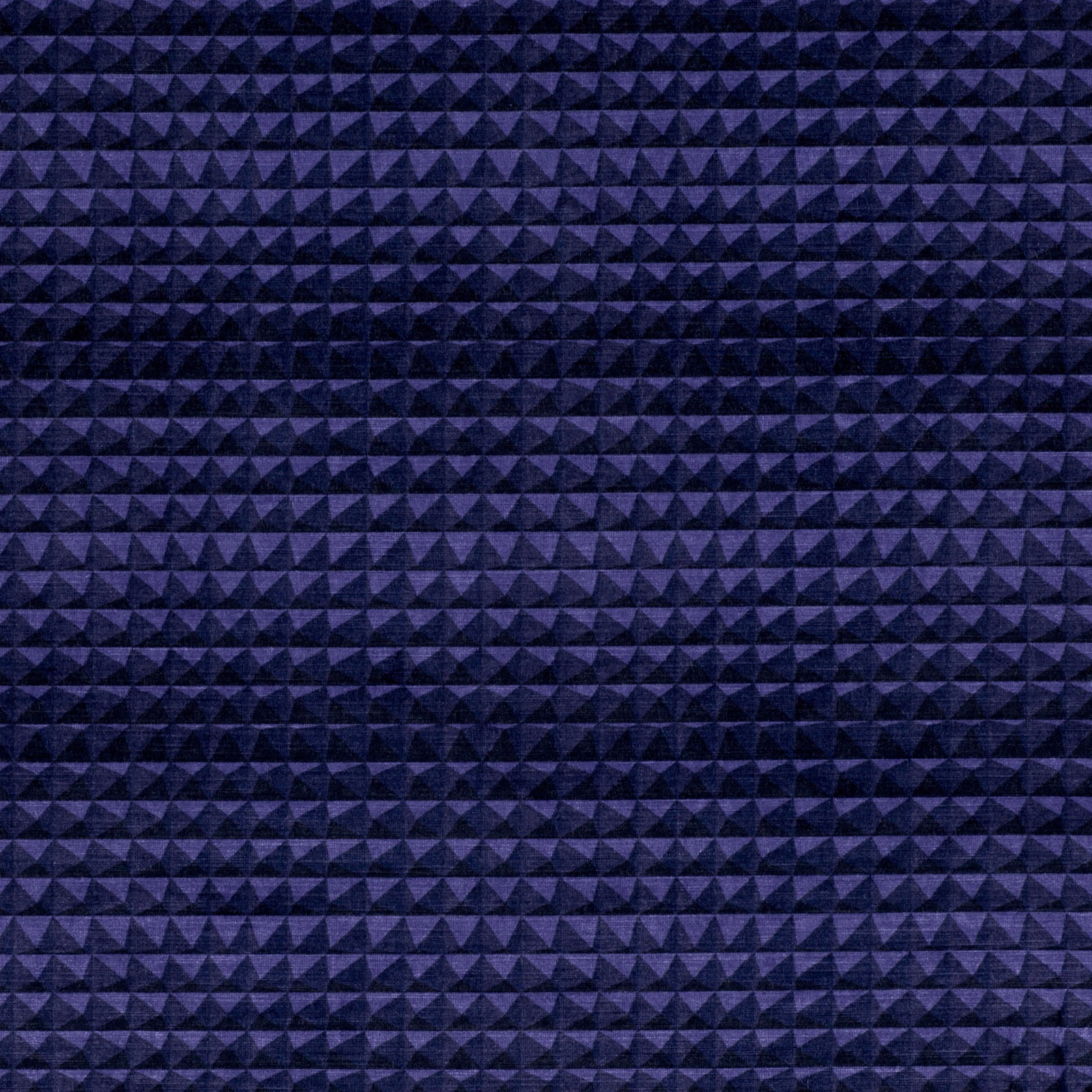 Close view of midnight-purple woven fabric with rows of tiny raised triangular pyramids