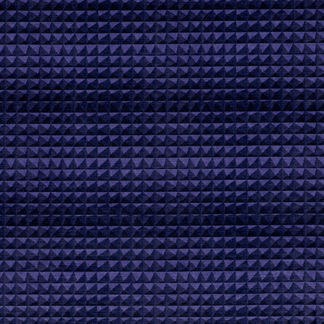 Close view of midnight-purple woven fabric with rows of tiny raised triangular pyramids