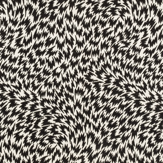 Dense black-and-cream jagged feather motif woven across a textured monochrome surface
