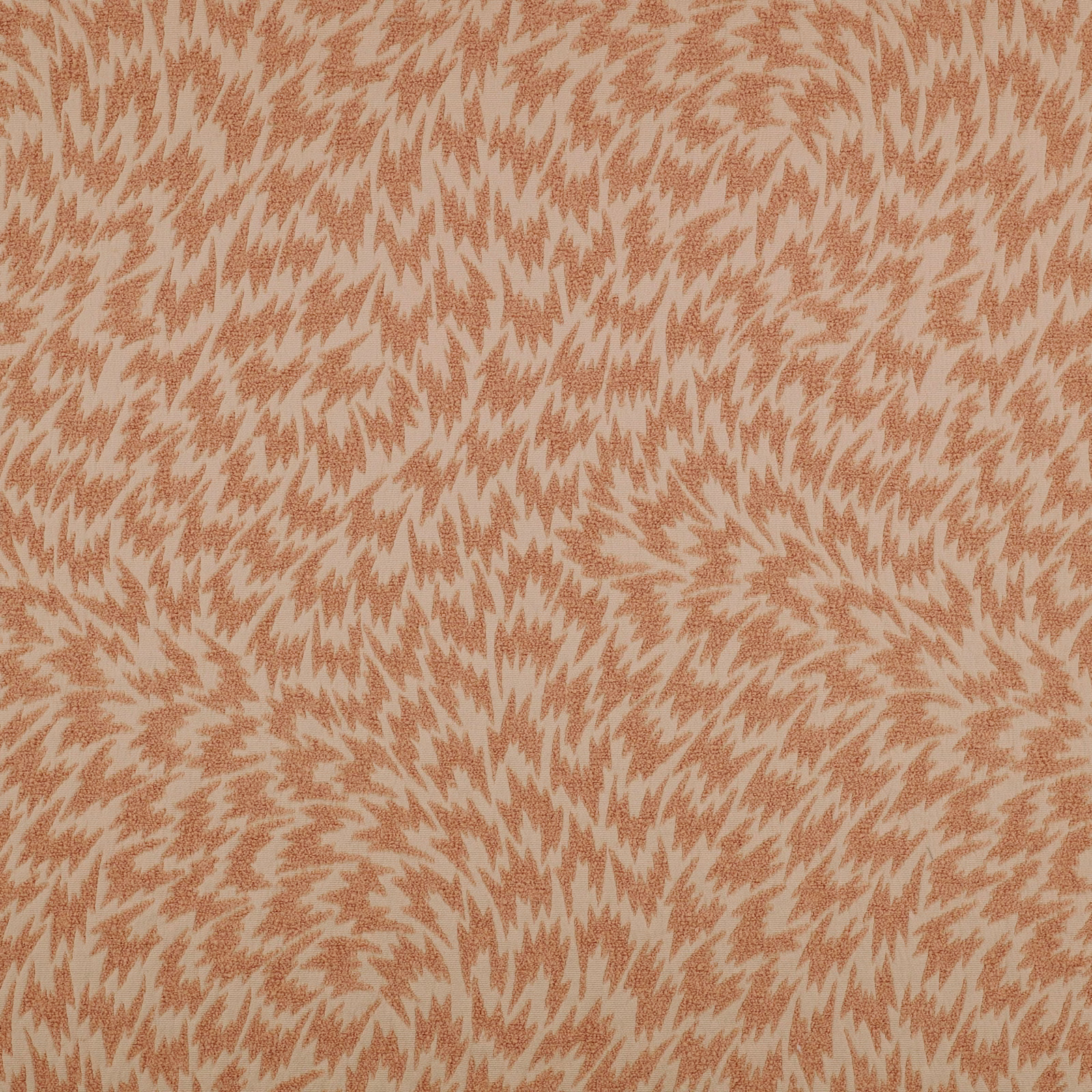 Apricot woven fabric with dusty pink flame-like motifs and softly textured surface