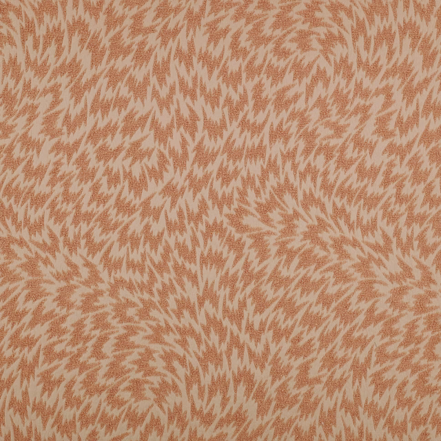 Apricot woven fabric with dusty pink flame-like motifs and softly textured surface