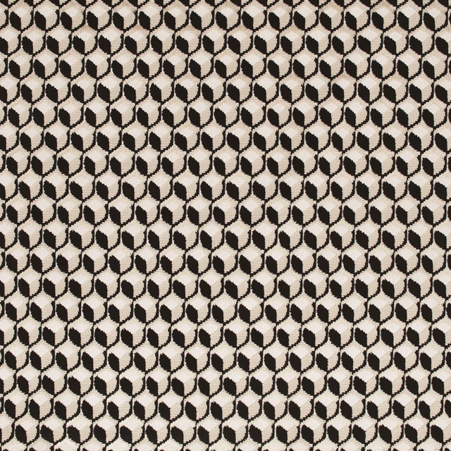 Close view of black and ivory woven fabric with a small linked geometric motif
