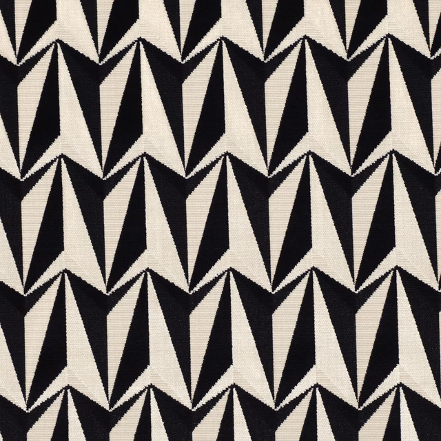 Black and ivory woven fabric with repeating angular rocket motifs